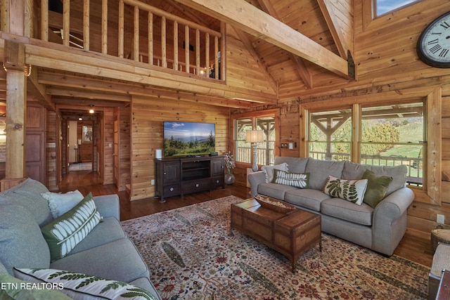 living room featuring wooden walls, high vaulted ceiling, wooden ceiling, beamed ceiling, and hardwood / wood-style floors