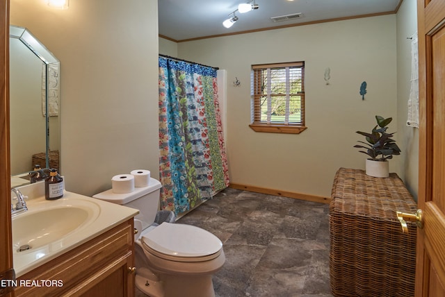 bathroom featuring vanity, toilet, and ornamental molding