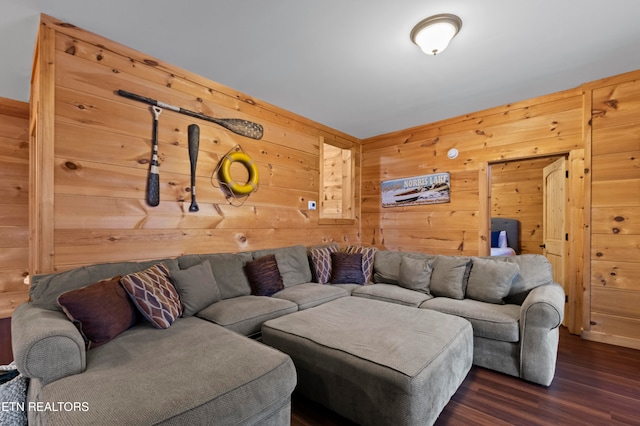 living room with wood walls and dark hardwood / wood-style floors