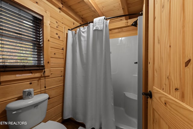 bathroom with beam ceiling, wooden ceiling, toilet, walk in shower, and wood walls