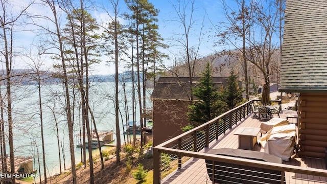 view of wooden balcony featuring a wooden deck and outdoor dining space