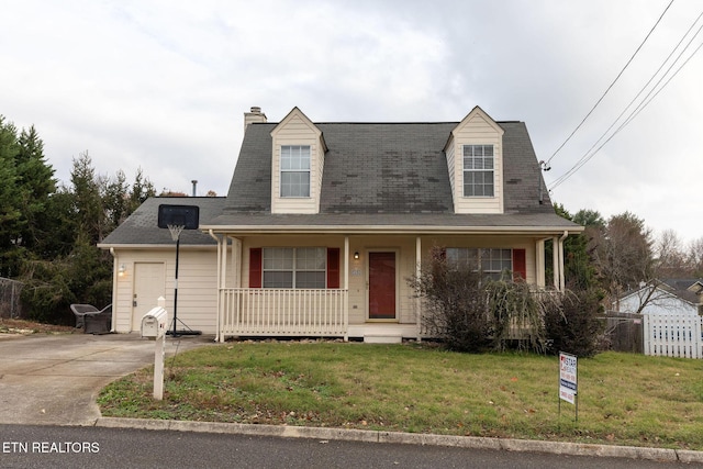 cape cod-style house featuring covered porch and a front lawn