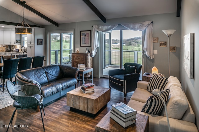 living room with lofted ceiling with beams and dark hardwood / wood-style flooring