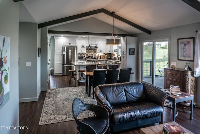 living room featuring vaulted ceiling with beams, dark hardwood / wood-style flooring, and sink