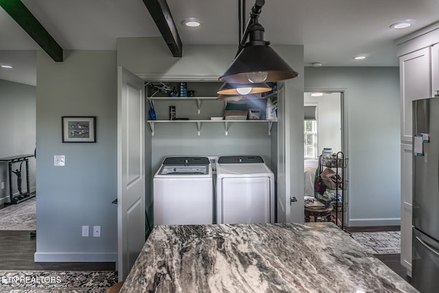 washroom featuring independent washer and dryer and dark hardwood / wood-style floors