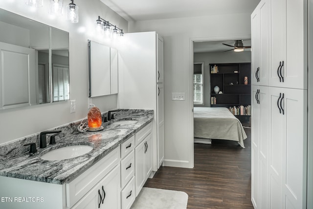 bathroom featuring hardwood / wood-style floors, vanity, and ceiling fan