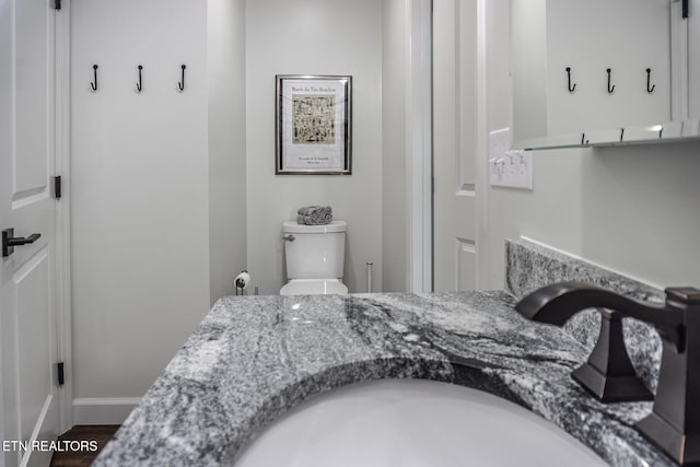 bedroom with wood-type flooring and sink