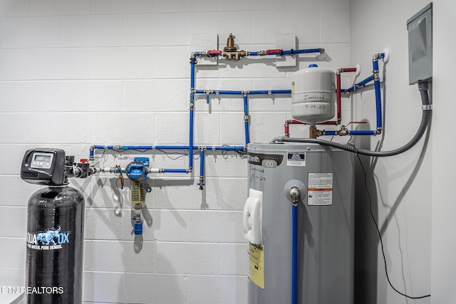 utility room featuring water heater