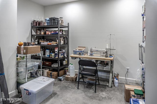 office area featuring concrete floors