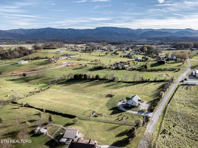 drone / aerial view featuring a mountain view and a rural view