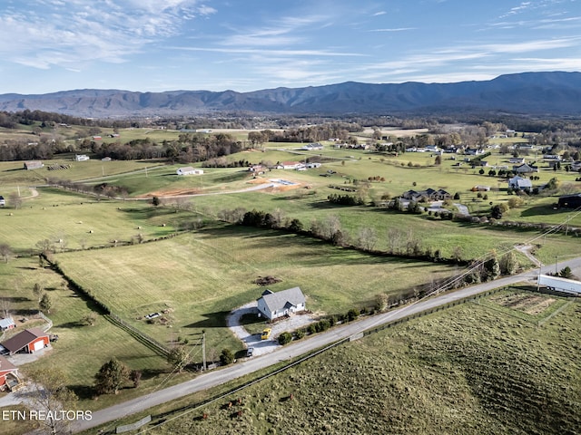 aerial view with a mountain view and a rural view