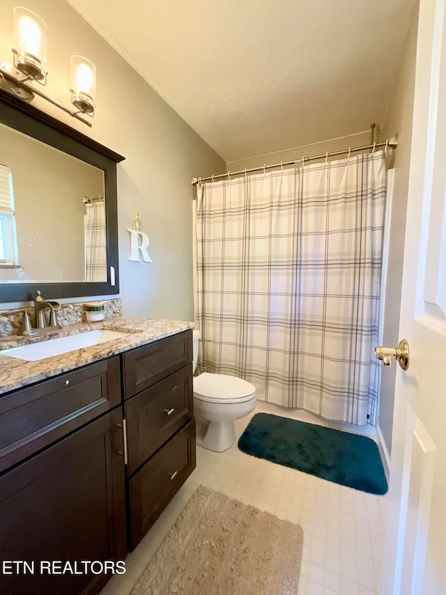 full bathroom with toilet, a textured ceiling, vanity, and a shower with shower curtain