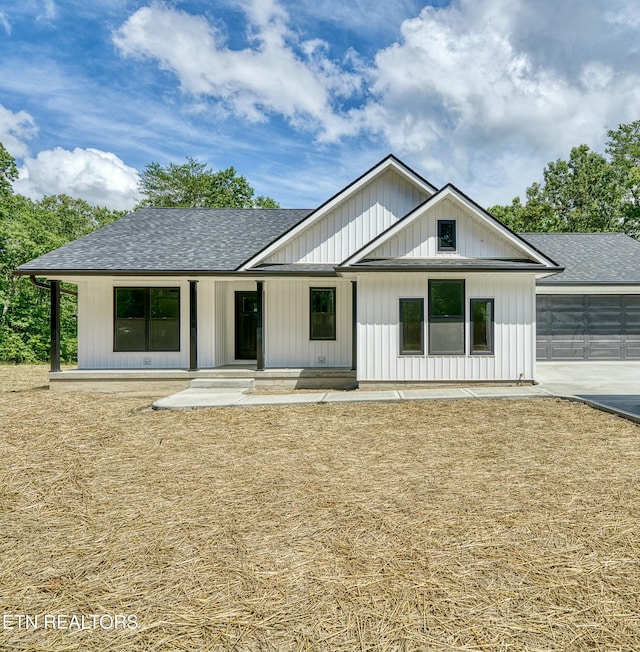 modern farmhouse style home featuring a garage