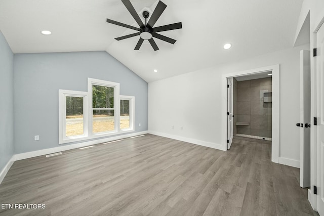 unfurnished living room featuring ceiling fan, light hardwood / wood-style floors, and lofted ceiling