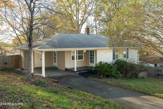 ranch-style home featuring a carport