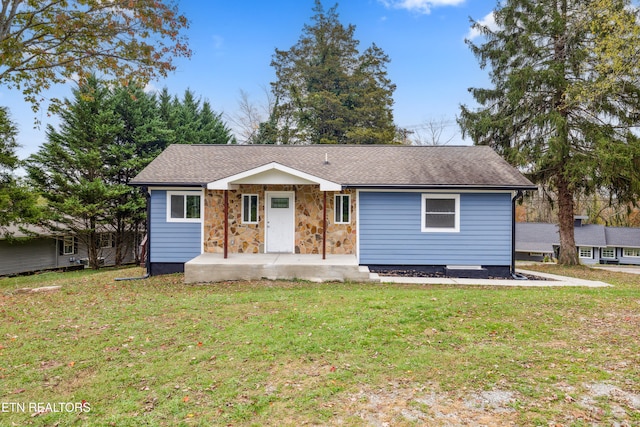 ranch-style house with a front lawn