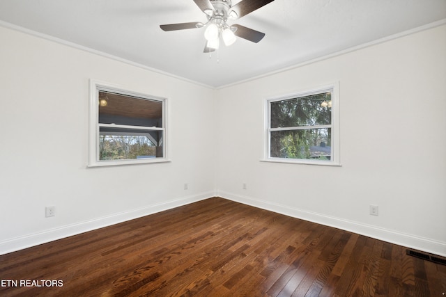 spare room featuring hardwood / wood-style flooring, ceiling fan, and ornamental molding