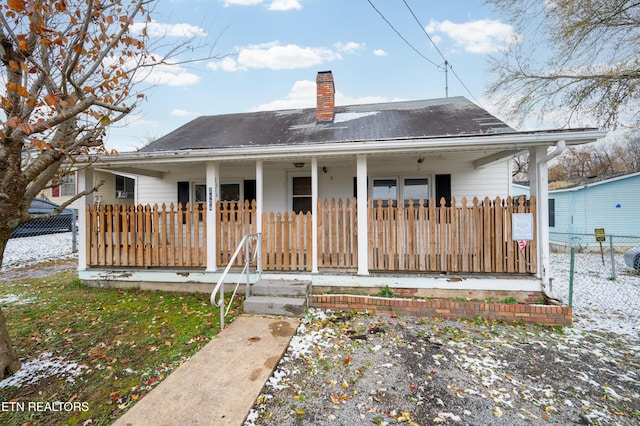 rear view of house with a porch