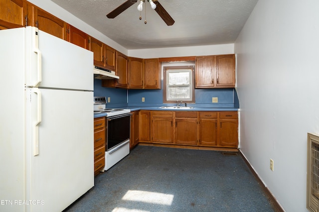 kitchen with a textured ceiling, ceiling fan, sink, and white appliances