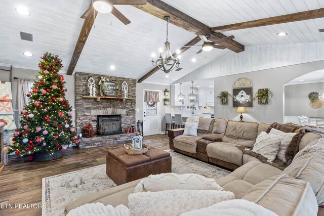 living room featuring vaulted ceiling with beams, wooden ceiling, ceiling fan with notable chandelier, and hardwood / wood-style flooring