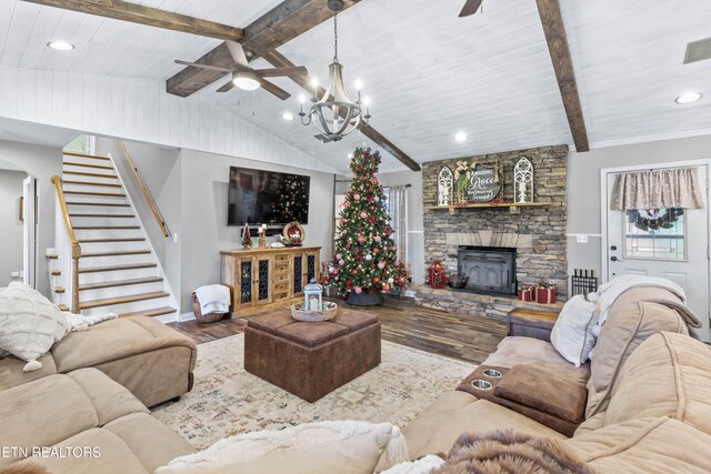 living room with vaulted ceiling with beams, wood-type flooring, a fireplace, wood ceiling, and ceiling fan with notable chandelier