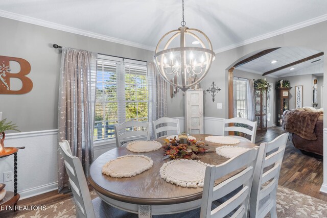 dining area featuring a chandelier, dark hardwood / wood-style flooring, and ornamental molding