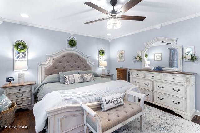 bedroom featuring dark hardwood / wood-style floors, ceiling fan, and crown molding