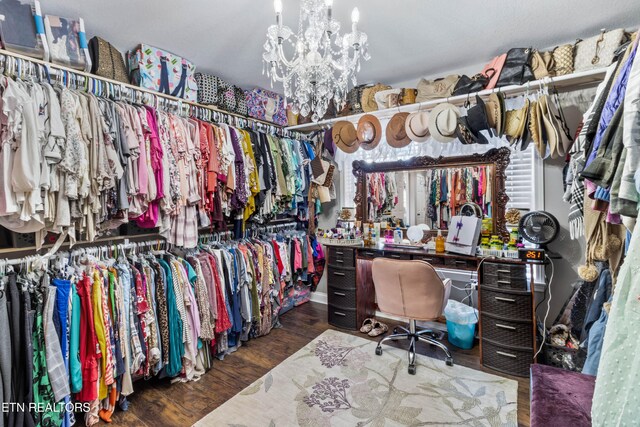 walk in closet featuring dark wood-type flooring