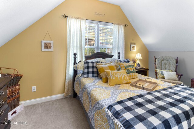 carpeted bedroom featuring vaulted ceiling