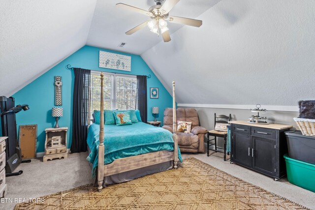 bedroom featuring ceiling fan, light carpet, and vaulted ceiling