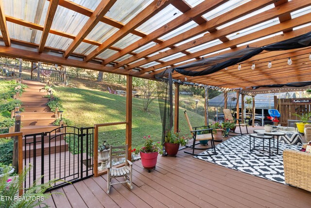 wooden terrace with a pergola