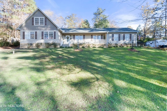 view of front of house with covered porch, crawl space, and a front yard