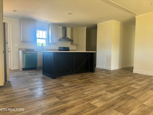 kitchen featuring stainless steel dishwasher, wall chimney exhaust hood, and hardwood / wood-style floors