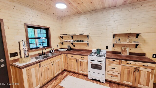 1312 Sweetwater Rd, Newport, TN 37821 - kitchen featuring open shelves, a sink, white range with gas stovetop, light brown cabinetry, and light wood-style floors