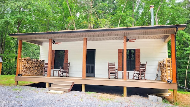 exterior space featuring ceiling fan and a porch