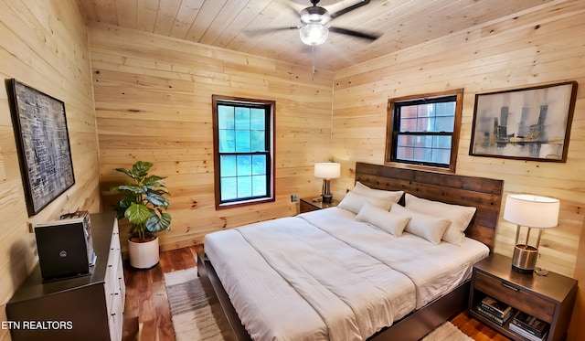 1312 Sweetwater Rd, Newport, TN 37821 - bedroom with wooden walls, wood finished floors, wood ceiling, and a ceiling fan