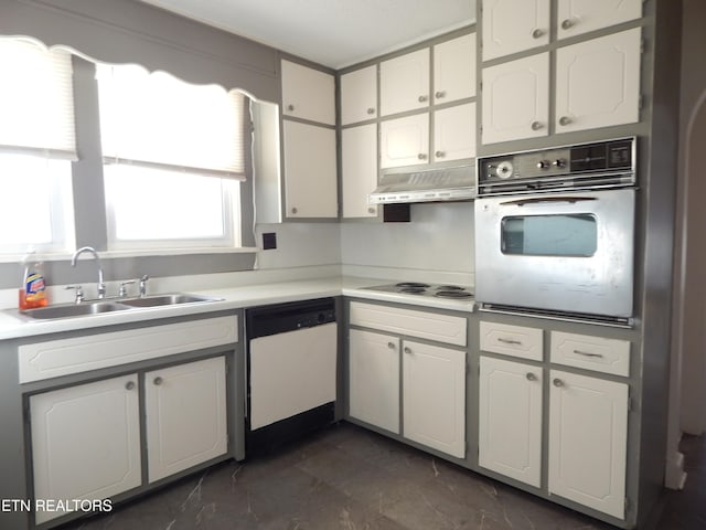 kitchen featuring white cabinets, white appliances, and sink