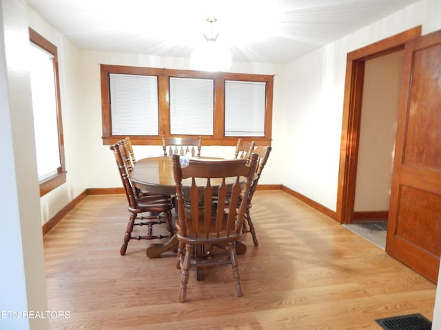 dining room with light wood-type flooring