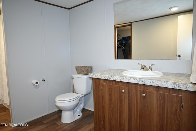 593 Cane Creek Mountain Rd, Tellico Plains, TN 37385 - bathroom featuring vanity, wood finished floors, toilet, and a closet