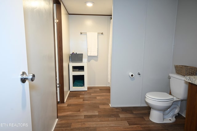 593 Cane Creek Mountain Rd, Tellico Plains, TN 37385 - bathroom with wood finished floors, toilet, and baseboards