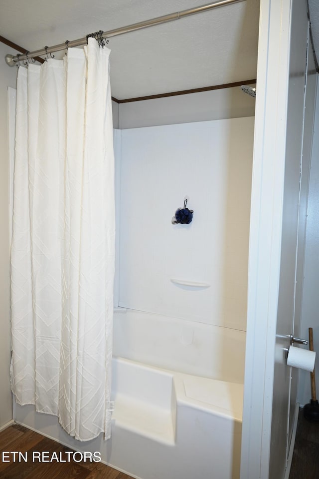 593 Cane Creek Mountain Rd, Tellico Plains, TN 37385 - bathroom with wood finished floors and shower / bath combo with shower curtain