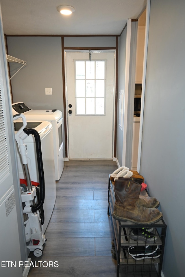 593 Cane Creek Mountain Rd, Tellico Plains, TN 37385 - washroom with washing machine and clothes dryer and wood finished floors