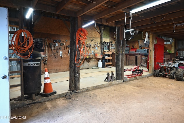 593 Cane Creek Mountain Rd, Tellico Plains, TN 37385 - basement featuring a workshop area