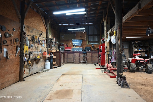 593 Cane Creek Mountain Rd, Tellico Plains, TN 37385 - garage featuring a workshop area