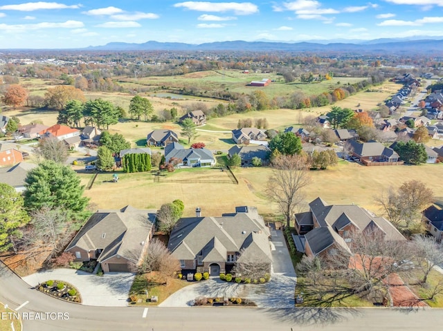 birds eye view of property with a mountain view