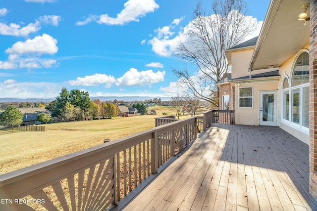 deck featuring a lawn