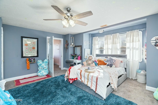 carpeted bedroom with ceiling fan