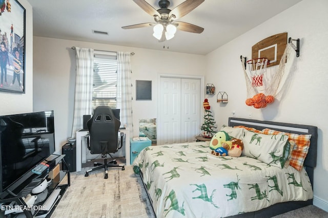 bedroom with ceiling fan, a closet, and carpet