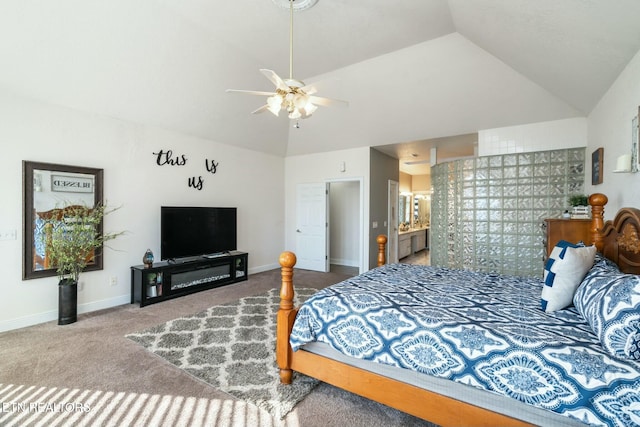 bedroom with carpet, vaulted ceiling, ensuite bath, and ceiling fan