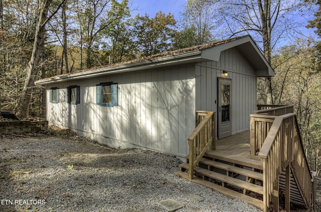 view of side of property with a deck